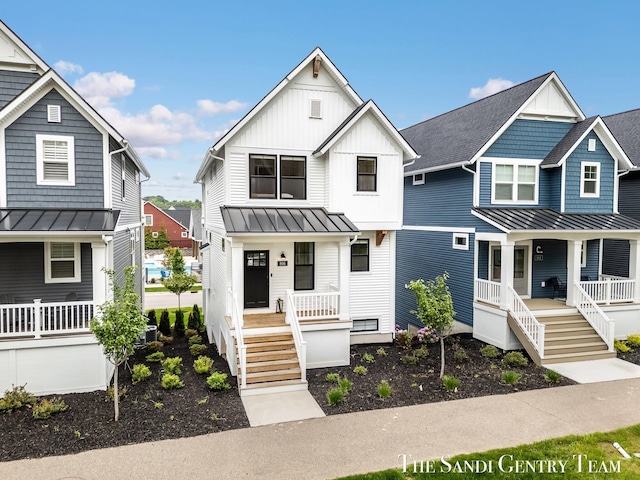 806 S Lake St, Whitehall, MI 49461 - view of front of house featuring a porch, a standing seam roof, a metal roof, and board and batten siding
