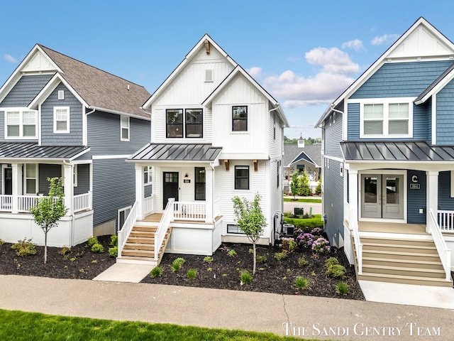 806 S Lake St, Whitehall, MI 49461 - multi unit property featuring a porch, a standing seam roof, and board and batten siding