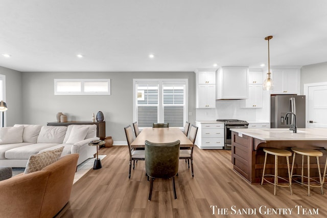 806 S Lake St, Whitehall, MI 49461 - dining space with light wood-style flooring, healthy amount of natural light, and recessed lighting