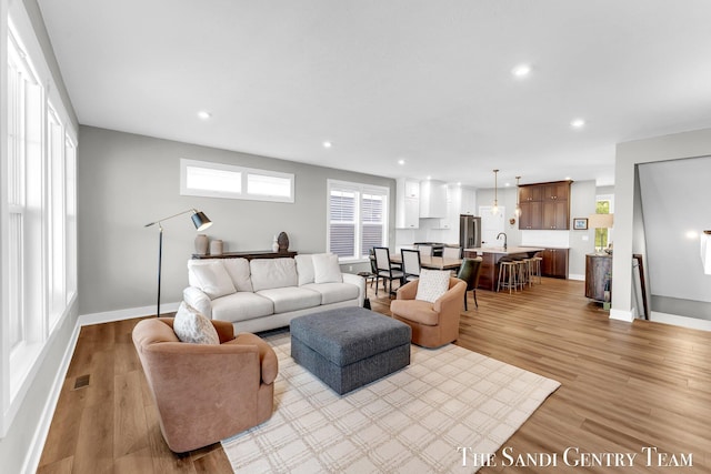 806 S Lake St, Whitehall, MI 49461 - living room featuring light wood-style flooring and recessed lighting