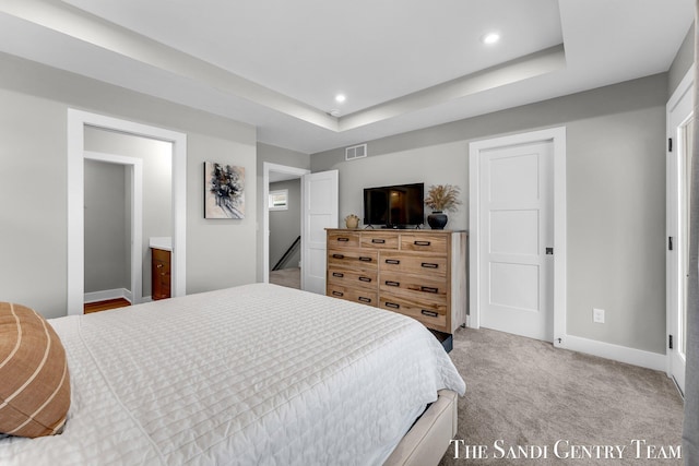 806 S Lake St, Whitehall, MI 49461 - bedroom featuring recessed lighting, light carpet, and a tray ceiling