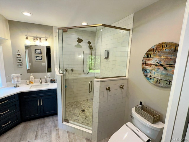 6771 Foxboro, Brighton, MI 48116 - bathroom with vanity, a stall shower, wood finished floors, and recessed lighting