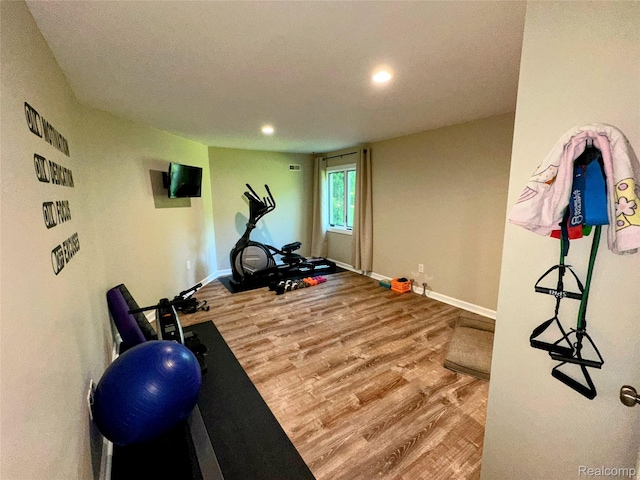 6771 Foxboro, Brighton, MI 48116 - workout room with wood finished floors and recessed lighting
