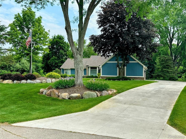 6771 Foxboro, Brighton, MI 48116 - view of front of home featuring a front lawn and driveway