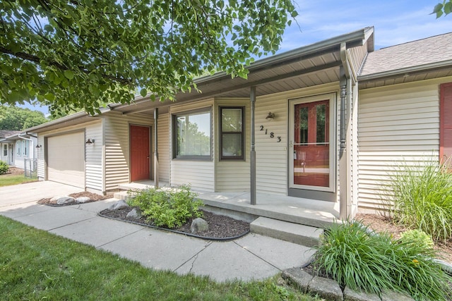 2183 Aaronsway Ct NE, Belmont, MI 49306 - ranch-style home featuring covered porch, a garage, and driveway