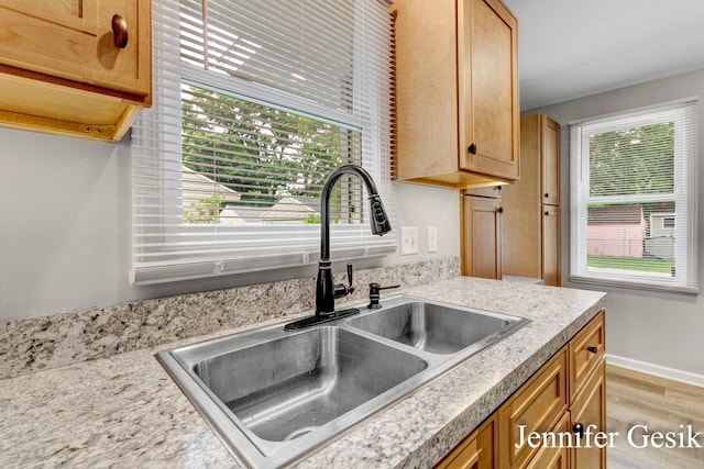 932 Kentfield St SW, Wyoming, MI 49509 - kitchen with light wood-type flooring and light countertops