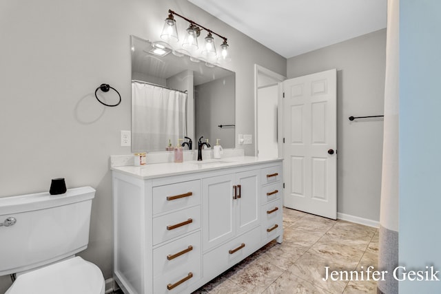 932 Kentfield St SW, Wyoming, MI 49509 - bathroom with toilet and vanity