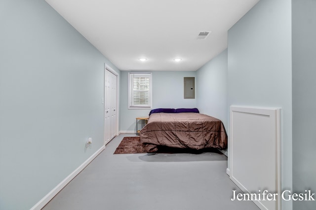 932 Kentfield St SW, Wyoming, MI 49509 - bedroom with electric panel, concrete flooring, and recessed lighting