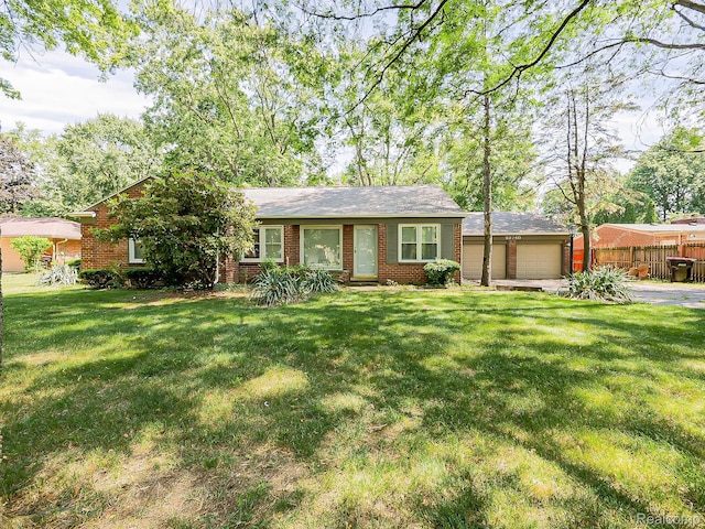 23740 Lee Baker Dr, Southfield, MI 48075 - view of front facade featuring brick siding and an outbuilding