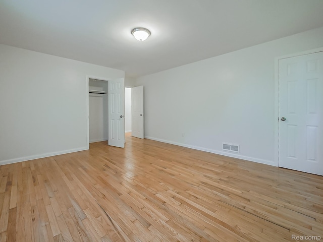 23740 Lee Baker Dr, Southfield, MI 48075 - unfurnished bedroom with light wood-type flooring and a closet