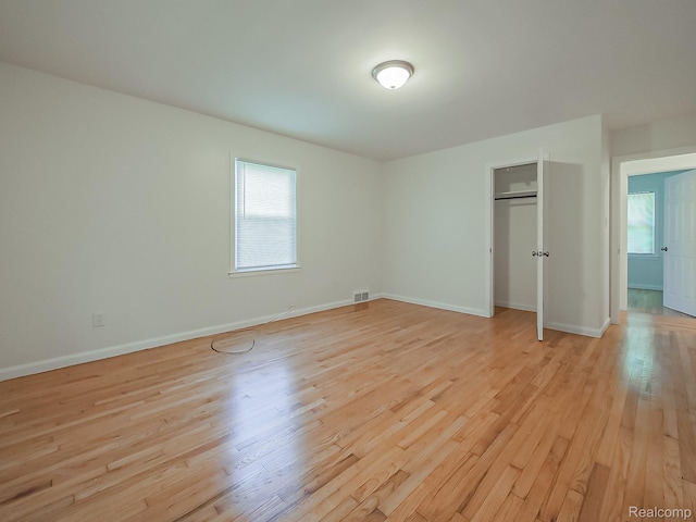 23740 Lee Baker Dr, Southfield, MI 48075 - unfurnished bedroom with light wood-type flooring and a closet