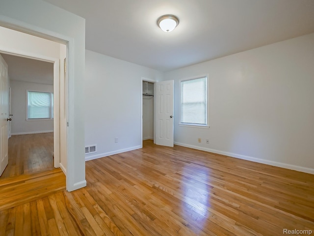 23740 Lee Baker Dr, Southfield, MI 48075 - unfurnished bedroom with light wood-style floors and a closet