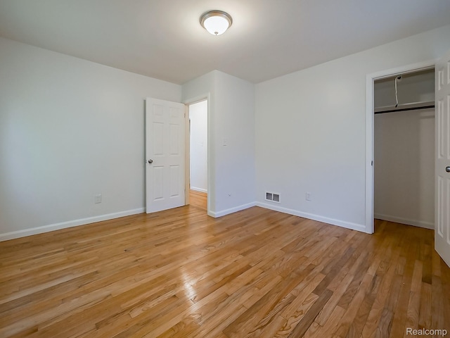 23740 Lee Baker Dr, Southfield, MI 48075 - unfurnished bedroom with light wood-type flooring and a closet