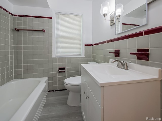 23740 Lee Baker Dr, Southfield, MI 48075 - full bath with wood finished floors, tile walls, vanity, a tub, and a chandelier