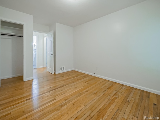 23740 Lee Baker Dr, Southfield, MI 48075 - unfurnished bedroom with light wood finished floors and a closet