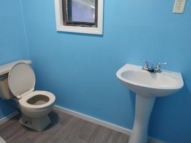 1830 Ferry St, Niles, MI 49120 - half bath featuring wood finished floors and toilet
