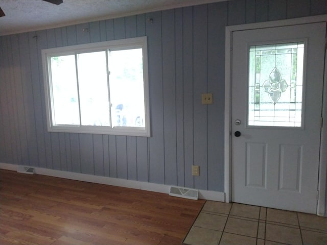 1830 Ferry St, Niles, MI 49120 - foyer entrance featuring wood finished floors, wood walls, and a ceiling fan