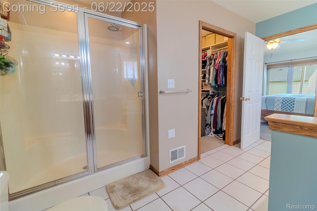 15980 Monterey St, Southgate, MI 48195 - full bathroom featuring a stall shower, tile patterned flooring, a spacious closet, and a ceiling fan