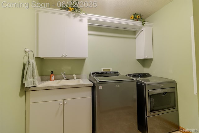 15980 Monterey St, Southgate, MI 48195 - washroom with cabinet space, separate washer and dryer, a textured ceiling, and tile patterned floors