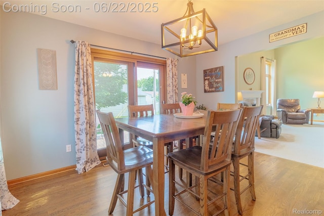 15980 Monterey St, Southgate, MI 48195 - dining room with wood finished floors and a chandelier