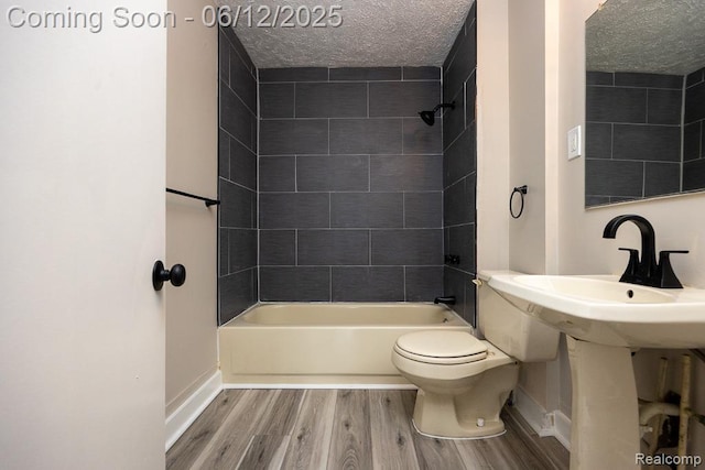 15834 Baylis St, Detroit, MI 48238 - full bath featuring wood finished floors, a textured ceiling, and shower / bathtub combination
