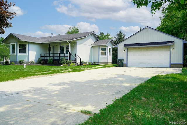 4865 Huston Dr, Lake Orion, MI 48359 - ranch-style house featuring covered porch, a front lawn, and a garage