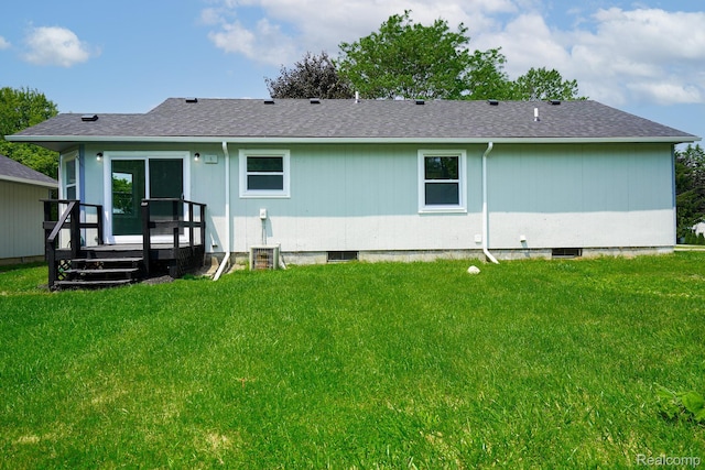 4865 Huston Dr, Lake Orion, MI 48359 - rear view of property with a yard, a wooden deck, and roof with shingles