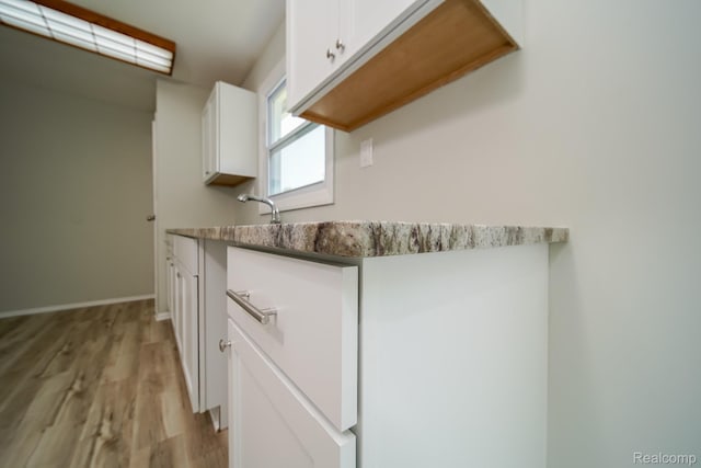 4865 Huston Dr, Lake Orion, MI 48359 - detailed view of wood finished floors and baseboards