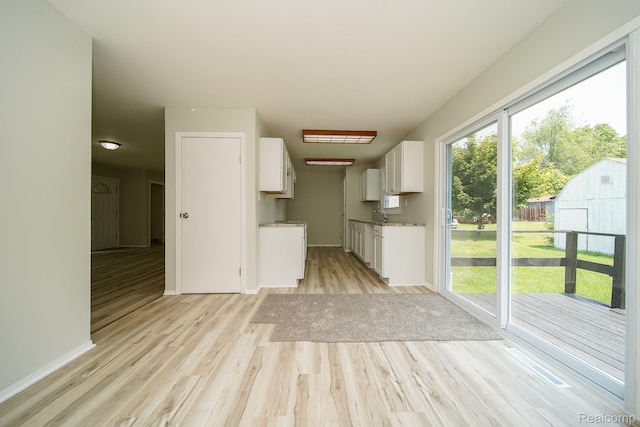 4865 Huston Dr, Lake Orion, MI 48359 - kitchen featuring light wood finished floors and white cabinetry