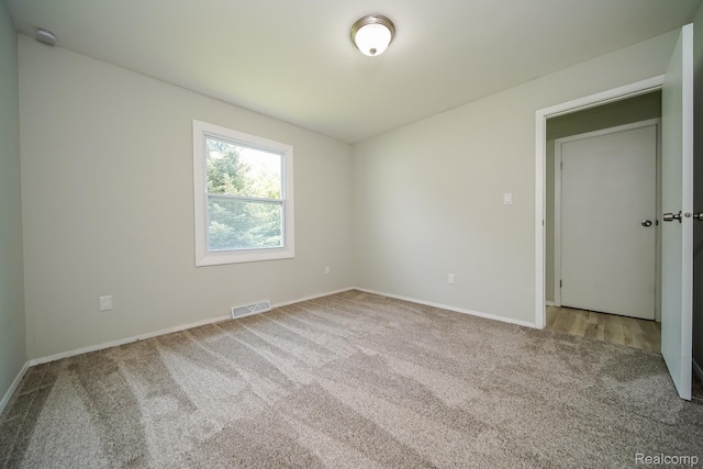 4865 Huston Dr, Lake Orion, MI 48359 - spare room featuring carpet flooring and baseboards