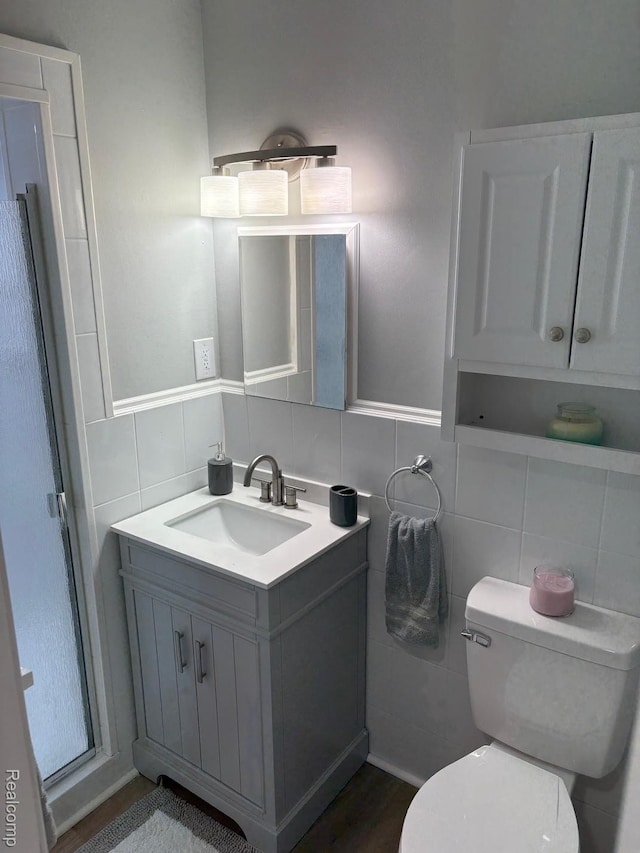 2211 Parkside St, Trenton, MI 48183 - bathroom featuring vanity, tile walls, and decorative backsplash