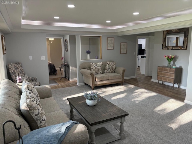 2211 Parkside St, Trenton, MI 48183 - living area with a tray ceiling, wood finished floors, ornamental molding, and recessed lighting