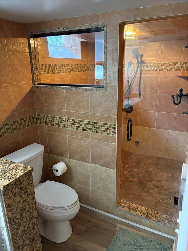 2211 Parkside St, Trenton, MI 48183 - full bath featuring wood finished floors, a stall shower, and tile walls