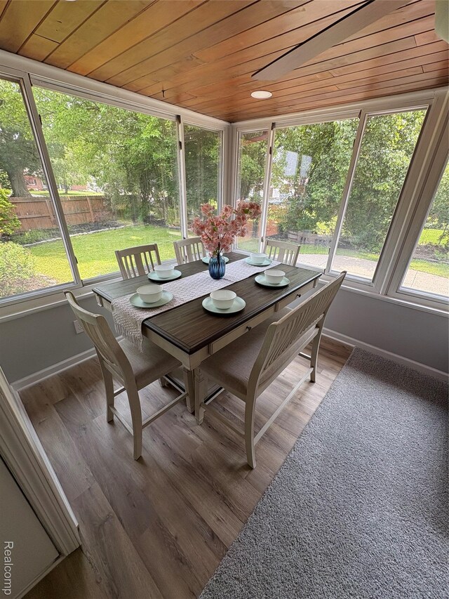 2211 Parkside St, Trenton, MI 48183 - sunroom with wooden ceiling, outdoor dining space, and wood finished floors