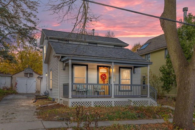 626 Hiscock St, Ann Arbor, MI 48103 - view of front of property featuring a porch, roof with shingles, an outbuilding, and asphalt driveway