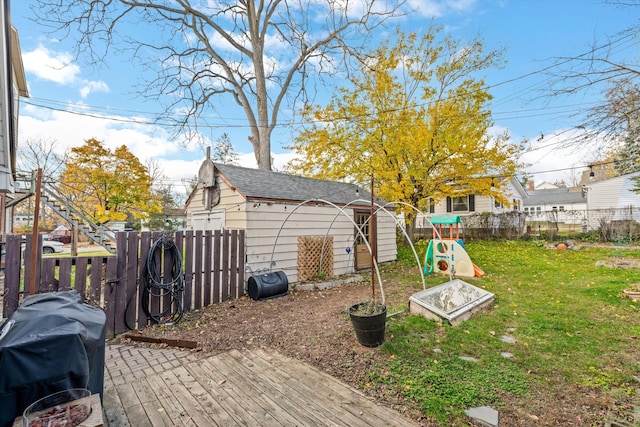 626 Hiscock St, Ann Arbor, MI 48103 - fenced backyard featuring a wooden deck and a shed