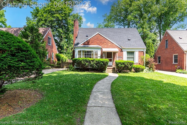 526 W Webster Rd, Royal Oak, MI 48073 - bungalow featuring a chimney, brick siding, a front lawn, and a shingled roof
