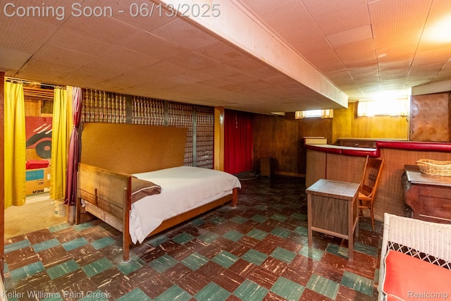 526 W Webster Rd, Royal Oak, MI 48073 - bedroom with tile patterned floors, wooden walls, and a bar