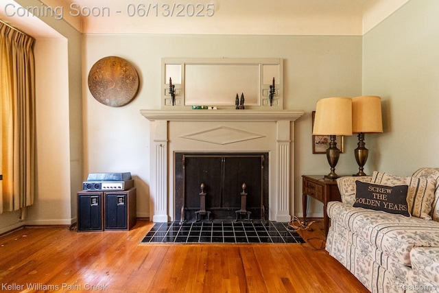 526 W Webster Rd, Royal Oak, MI 48073 - living room featuring a tiled fireplace and hardwood / wood-style flooring