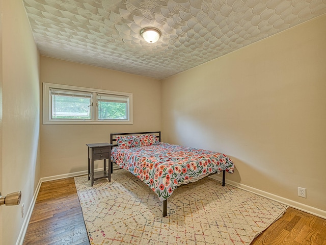 219 Park St, Tecumseh, MI 49286 - bedroom featuring wood finished floors