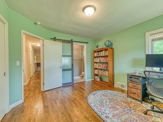 219 Park St, Tecumseh, MI 49286 - office space featuring wood finished floors and a barn door