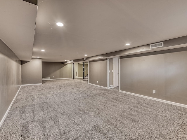 219 Park St, Tecumseh, MI 49286 - finished basement with carpet flooring, recessed lighting, and stairway