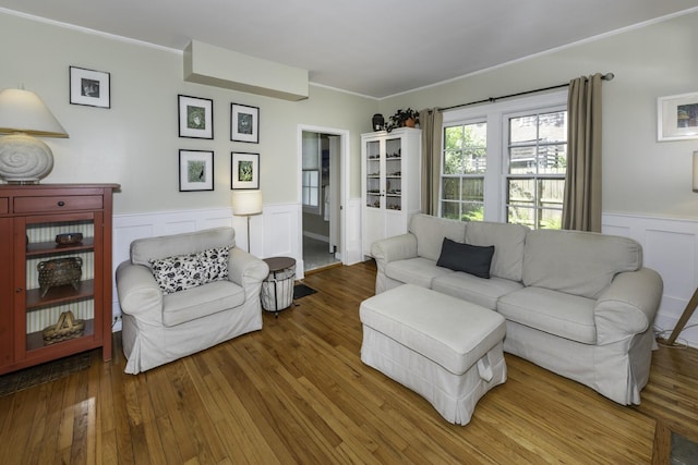3444 Broad St, Dexter, MI 48130 - living area with wainscoting, crown molding, wood finished floors, and a decorative wall