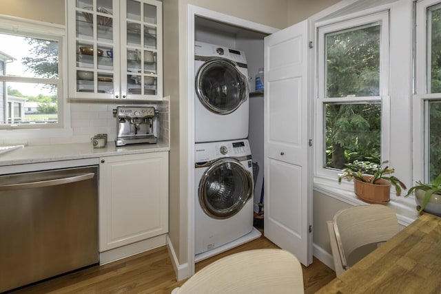 3444 Broad St, Dexter, MI 48130 - washroom with stacked washing machine and dryer and wood finished floors
