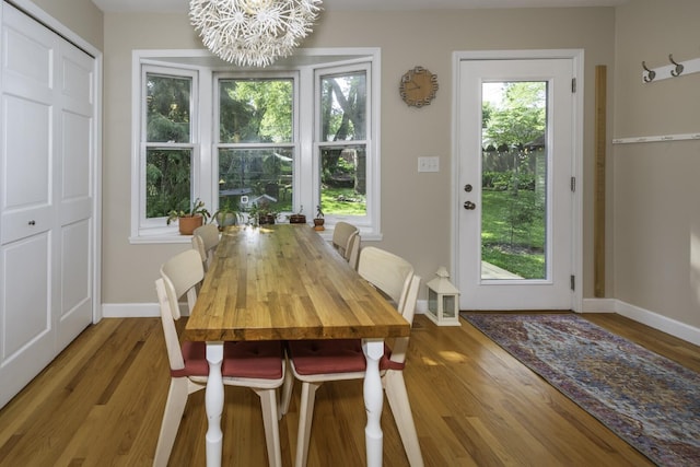 3444 Broad St, Dexter, MI 48130 - dining space with a chandelier and wood finished floors