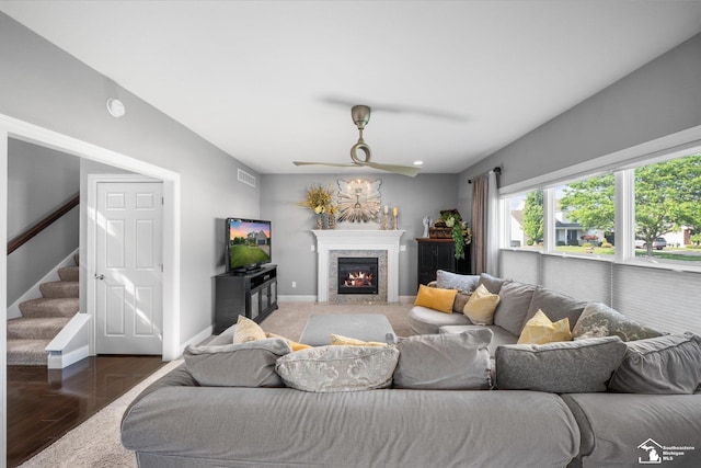 696 Webber Dr, Temperance, MI 48182 - living room with ceiling fan, a premium fireplace, stairs, and wood finished floors