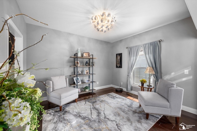 696 Webber Dr, Temperance, MI 48182 - living area with wood finished floors and a chandelier