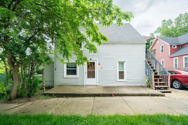 635 Sinclair Ave NE, Grand Rapids, MI 49503 - back of house with a patio, stairway, and a shingled roof