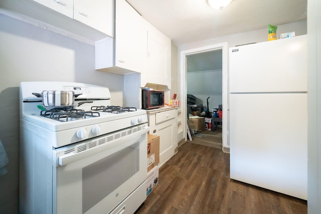 635 Sinclair Ave NE, Grand Rapids, MI 49503 - kitchen featuring white appliances, white cabinets, dark wood-style floors, and light countertops