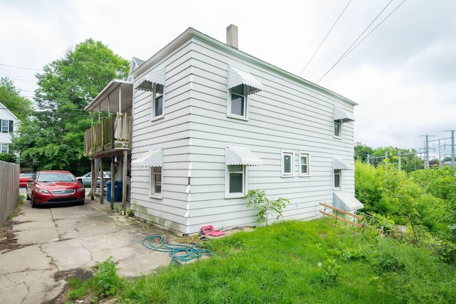635 Sinclair Ave NE, Grand Rapids, MI 49503 - view of side of property with a chimney